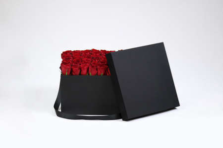 Black square gift flower box with red roses inside
