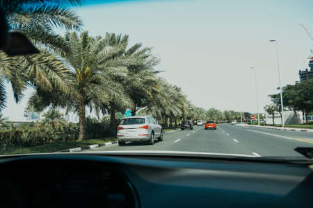 Driving Car in Big City Dubai UAE with Traffic on the Highway Roadの写真素材