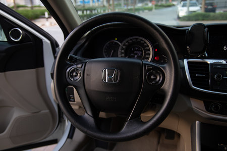 Dubai, UAE â May 9, 2020 Honda steering wheel close-up with car interior dashboard view, cruise control and audio controlsのeditorial素材