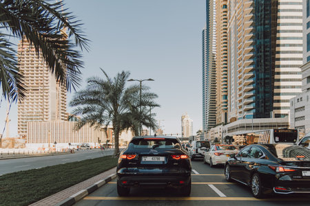 Dubai, UAE - February 14 2020: Traffic jam in Dubai Marina district with modern skyscrapers and palm treesのeditorial素材