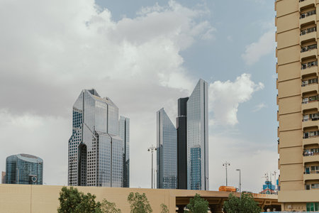 Modern skyline with unique skyscrapers under a cloudy sky