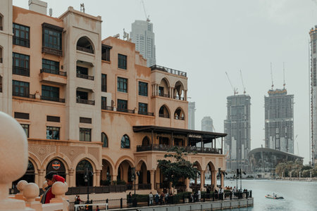 Dubai, UAE - February 12, 2020: Traditional architecture of Souk Al Bahar with modern skyscrapers near Dubai Mallのeditorial素材