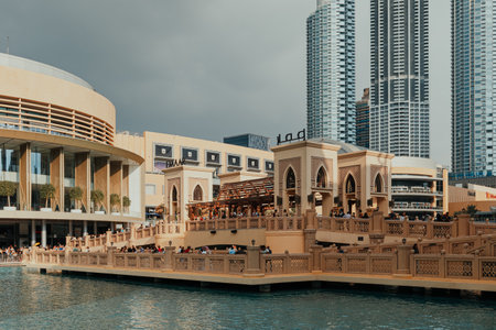 Dubai, UAE - February 12, 2020: Busy afternoon at Souk Al Bahar overlooking Dubai Mall and skyscrapersのeditorial素材