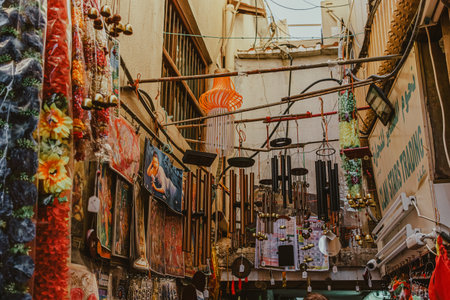 Dubai, UAE - January 6, 2020: Decorative wind chimes and vibrant garlands displayed in Grand Souq,...