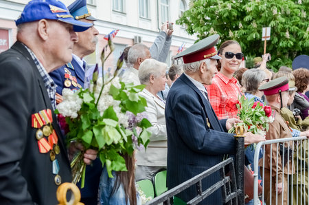 Kerch, Russia 05 09 2019: Parade Victory Day. People participate in the patriotic action Immortal Regiment. They are holding portraits of people who participated in the Great Patriotic War.のeditorial素材