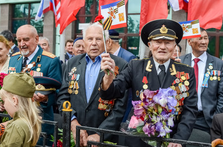 Kerch, Russia 05 09 2019: Parade Victory Day. People participate in the patriotic action Immortal Regiment. They are holding portraits of people who participated in the Great Patriotic War.のeditorial素材