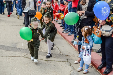 Kerch, Russia 05 09 2019: Parade Victory Day. People participate in the patriotic action Immortal Regiment. They are holding portraits of people who participated in the Great Patriotic War.のeditorial素材