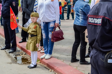 Kerch, Russia 05 09 2019: Parade Victory Day. People participate in the patriotic action Immortal Regiment. They are holding portraits of people who participated in the Great Patriotic War.のeditorial素材