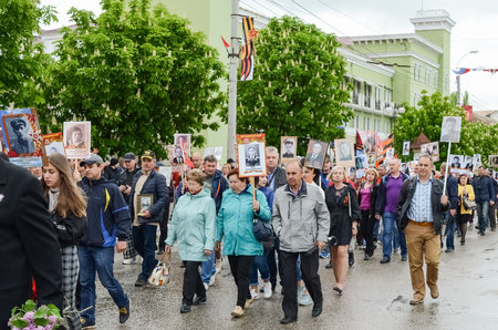 Kerch, Russia 05 09 2019: Parade Victory Day. People participate in the patriotic action Immortal Regiment. They are holding portraits of people who participated in the Great Patriotic War.のeditorial素材