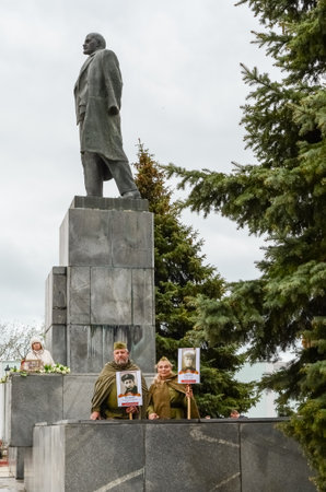 Kerch, Russia 05 09 2019: Parade Victory Day. People participate in the patriotic action Immortal Regiment. They are holding portraits of people who participated in the Great Patriotic War.のeditorial素材
