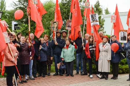 Kerch, Russia 05 09 2019: Parade Victory Day. People participate in the patriotic action Immortal Regiment. They are holding portraits of people who participated in the Great Patriotic War.のeditorial素材