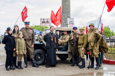 Kerch, Russia 05 09 2019: Parade Victory Day. People participate in the patriotic action Immortal Regiment. They are holding portraits of people who participated in the Great Patriotic War.のeditorial素材