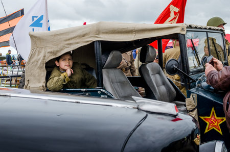 Kerch, Russia 05 09 2019: Parade Victory Day. People participate in the patriotic action Immortal Regiment. They are holding portraits of people who participated in the Great Patriotic War.のeditorial素材