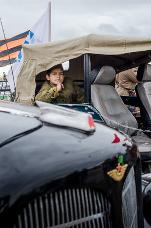 Kerch, Russia 05 09 2019: Parade Victory Day. People participate in the patriotic action Immortal Regiment. They are holding portraits of people who participated in the Great Patriotic War.のeditorial素材