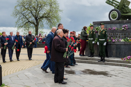 Kerch, Russia 05 09 2019: Parade Victory Day. People participate in the patriotic action Immortal Regiment. They are holding portraits of people who participated in the Great Patriotic War.のeditorial素材