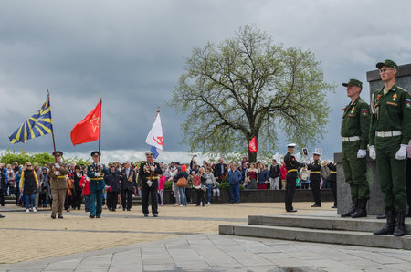 Kerch, Russia 05 09 2019: Parade Victory Day. People participate in the patriotic action Immortal Regiment. They are holding portraits of people who participated in the Great Patriotic War.のeditorial素材