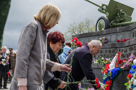 Kerch, Russia 05 09 2019: Parade Victory Day. People participate in the patriotic action Immortal Regiment. They are holding portraits of people who participated in the Great Patriotic War.のeditorial素材
