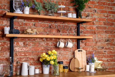 Contemporary kitchen background with kitchen utensils standing on wooden countertop, , front viewの写真素材