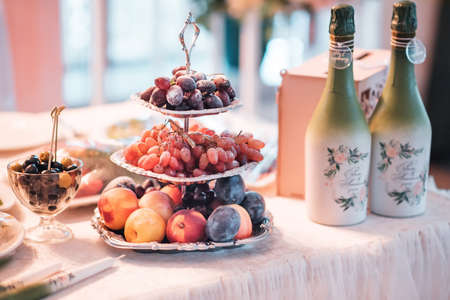 Wedding decor in a restaurant on the table. Banquet hall and decor elements in wedding love colors