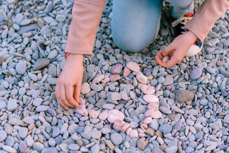 Garmony meditation, woman hand picking up set zen stones, relaxed hobby restの写真素材