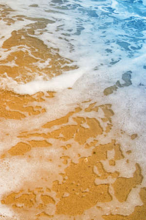 Soft wave of the sea on the sandy beach, summer vacation time