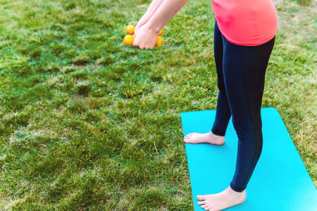Yoga in garden with Yoga mat, asana summer timeの写真素材