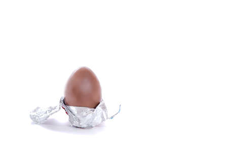 tasty chocolate egg on white, easter time