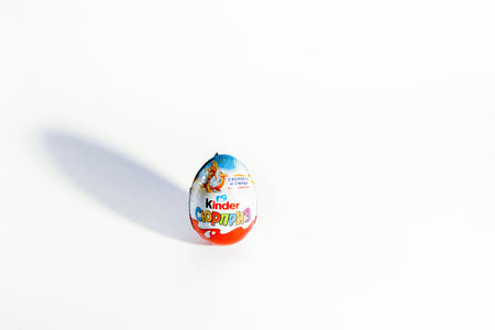 Moscow, Russia - April 1, 2022:: Kinder Surprise , tasty chocolate egg on white easter time