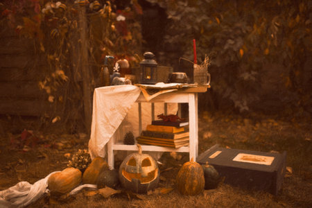Happy halloween Carving pumpkin on the table in the garden. Happy family preparing for Halloween. background photoの写真素材