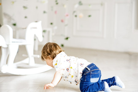 crawling funny baby boy indoors at home