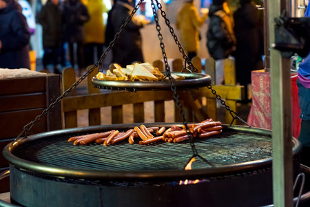 Moscow12/19/2023 - New Year, sausages and toast are fried on the street, walks in the decorated city, Christmas in Moscow, decorated square, decor everywhereの写真素材