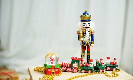 New Year's decor on the table, the nutcracker - the hero of the Christmas holiday, a wooden figurineの写真素材