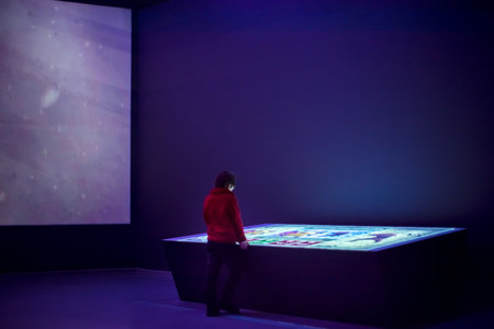 Interactive Touch Screen Table With Display. Kid looking in it, VDNKH Historical Museum Moscowの写真素材