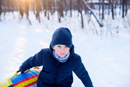 Winter recreation and fun, snow, flat sleddingの写真素材