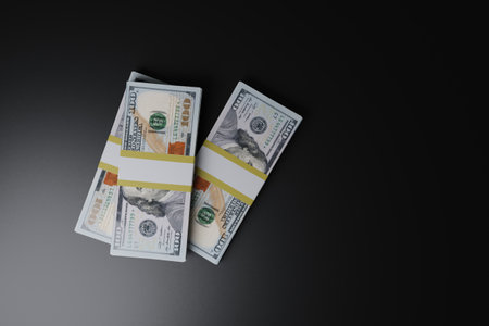Dollars banknotes isolated on a black background with copy space