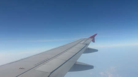 Airplane wing at sky の素材