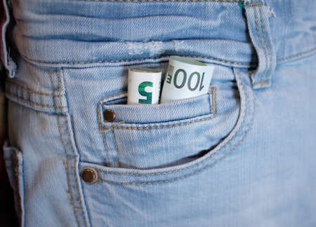 Banknote 5 100 euro money folds and looks out of pocket, concept of theft. Close-up of five and...