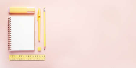 Top view flat lay of woman yellow workspace desk styled design office supplies with copy space on a...