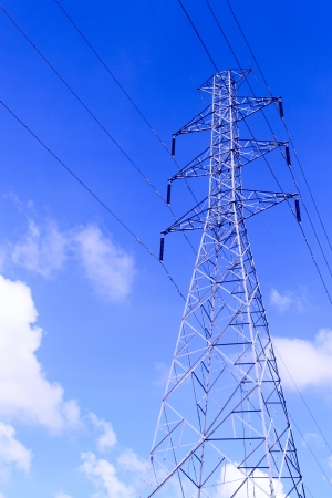 High voltage towers and blue sky の写真素材