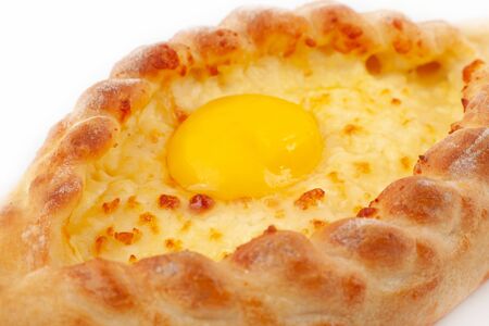 Closeup Adjar Khachapuri. Khachapuri Boat. Georgian national pie khachapuri with egg, cheese and...