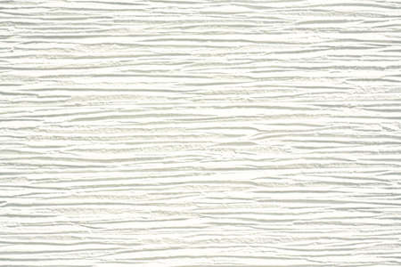 Textured white wall with horizontal lines.