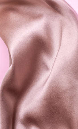 Abstract background in soft colors of silk fabrics on pink pearl paper. Beautiful trend texture.の写真素材