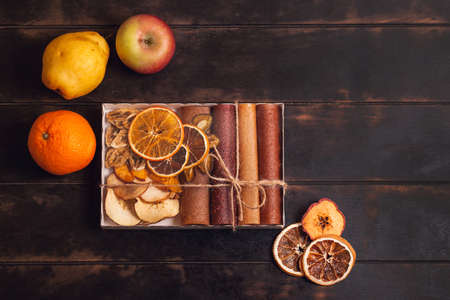 Gift with healthy sweets. Sweet fruit snacks in a package - pastilles and dried fruit. Fruit candy, Sugar Free, healthy nutrition.の写真素材