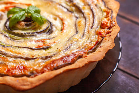 Background of Vegetable Spiral tart with zucchini, eggplant, carrot, close up macro shoot.の写真素材