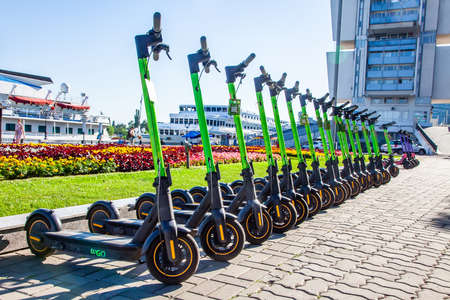 Scooter rental station. Electric Kick scooters in sharing parking. Rostov-on-Don, Russia, august 07 2021.のeditorial素材