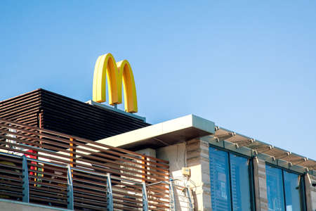 Rostov-on-Don, Russia, august 07 2021. The building of a McDonald's fast food restaurant with a close-up logo.のeditorial素材