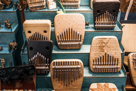 Kalimba or Mbira musical instrument on stand of Exhibition and sale of handmade folk instruments. Relaxation methods and techniques through anti-stress music, healing sounds.の写真素材