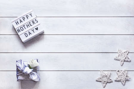 Light box with lettering Happy Mother's Day, gift box trendy wrapped in silk fabric in Furoshiki...