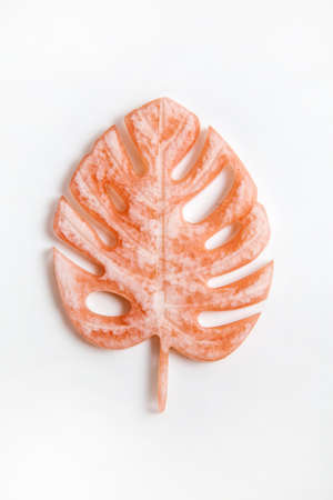 Handmade epoxy resin product: a stand for jewelry in the form of a monstera leaf.