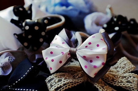 A few elastic hair bands in the shape of bows and flowersの写真素材